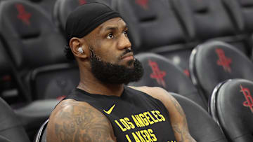 Nov 8, 2023; Houston, Texas, USA;  Los Angeles Lakers forward LeBron James (23) sits on the bench