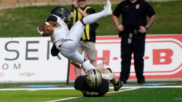 Andrews' Jaesean DeBouse is tackled during a Texas high school football game on Sept. 22, 2023.