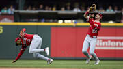 Sep 14, 2025; Seattle, Washington, USA; Los Angeles Angels second baseman Christian Moore (4) backs away as Los Angeles Angels center fielder Bryce Teodosio (22) catches Seattle Mariners left fielder Randy Arozarena (56) during the seventh inning at T-Mobile Park. Mandatory Credit: John Froschauer-Imagn Images