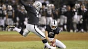 Aug 23, 2013; Oakland, CA, USA; Oakland Raiders kicker Sebastian Janikowski (11) kicks the field goal against the Chicago Bears with the hold by punter Chris Kluwe (5) during the third quarter at O.co Coliseum. The Chicago Bears defeated the Oakland Raiders 34-26. 