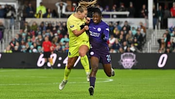 Nov 23, 2024; Kansas City, Missouri, USA;   Washington Spirit defender Tara McKeown (9) and Orlando Pride forward Barbra Banda (22) collide as they chase the ball in the 2024 NWSL Championship match at CPKC Stadium. Mandatory Credit: Amy Kontras-Imagn Images