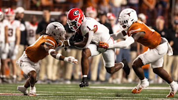 Oct 19, 2024; Austin, Texas, USA; Georgia Bulldogs running back Trevor Etienne (1) runs the ball against the Texas Longhorns during the first half at Darrell K Royal-Texas Memorial Stadium. Mandatory Credit: Brett Patzke-Imagn Images