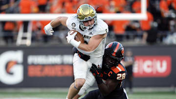 Sep 9, 2023; Corvallis, Oregon, USA; UC Davis Aggies running back Lan Larison (3) is tackled by Oregon State Beavers defensive back Kiran Oladapo (28) during the first half at Reser Stadium. Mandatory Credit: Soobum Im-Imagn Images