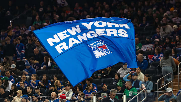 Mar 16, 2025; New York, New York, USA; A New York Rangers flag is seen in the crown during the first period against the Edmonton Oilers at Madison Square Garden. 