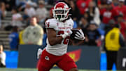 Nov 30, 2024; Pasadena, California, USA; Fresno State Bulldogs running back Bryson Donelson (26) carries the ball during the third quarter against the UCLA Bruins at Rose Bowl. Mandatory Credit: Robert Hanashiro-Imagn Images