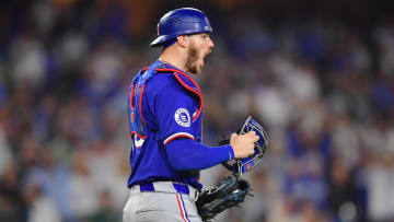 Jun 12, 2024; Los Angeles, California, USA; Texas Rangers catcher Jonah Heim (28) reacts after tagging out Los Angeles Dodgers center fielder Andy Pages (44) for the last out of the game and victory at Dodger Stadium. Mandatory Credit: Gary A. Vasquez-USA TODAY Sports