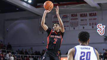 Dec 17, 2024; Queens, New York, USA;  St. John's basketball guard Simeon Wilcher (7) takes a three point shot in the second half against the DePaul Blue Demons at Carnesecca Arena. 