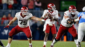 Oct 7, 2023; Oxford, Mississippi, USA; Arkansas Razorbacks offensive linemen Patrick Kutas (75) and Arkansas Razorbacks offensive linemen Joshua Braun (78) block during the second half against the Mississippi Rebels at Vaught-Hemingway Stadium. Mandatory Credit: Petre Thomas-Imagn Images