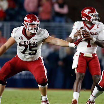 Oct 7, 2023; Oxford, Mississippi, USA; Arkansas Razorbacks offensive linemen Patrick Kutas (75) and Arkansas Razorbacks offensive linemen Joshua Braun (78) block during the second half against the Mississippi Rebels at Vaught-Hemingway Stadium. Mandatory Credit: Petre Thomas-Imagn Images