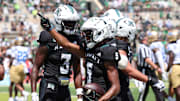 Aug 31, 2024; Honolulu, Hawaii, USA; Hawaii Rainbow Warriors wide receiver Pofele Ashlock (5) reacts after he made a first-quarter touchdown against the UCLA Bruins during an NCAA college football game at the Clarence T.C. Ching Athletics Complex. 