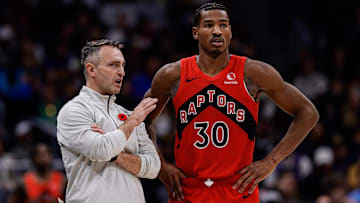 Nov 4, 2024; Denver, Colorado, USA; Toronto Raptors head coach Darko Rajakovic talks with guard Ochai Agbaji (30) in the fourth quarter against the Denver Nuggets at Ball Arena. Mandatory Credit: Isaiah J. Downing-Imagn Images