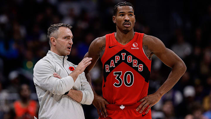 Nov 4, 2024; Denver, Colorado, USA; Toronto Raptors head coach Darko Rajakovic talks with guard Ochai Agbaji (30) in the fourth quarter against the Denver Nuggets at Ball Arena. Mandatory Credit: Isaiah J. Downing-Imagn Images
