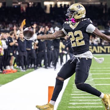 Sep 14, 2025; New Orleans, Louisiana, USA;  New Orleans Saints wide receiver Rashid Shaheed (22) scores a touchdown against San Francisco 49ers safety Jason Pinnock (25) during the second half at Caesars Superdome. Mandatory Credit: Stephen Lew-Imagn Images