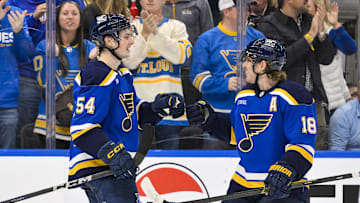 Nov 3, 2025; St. Louis, Missouri, USA; St. Louis Blues right wing Dalibor Dvorsky (54) is congratulated by center Robert Thomas (18) after scoring his first NHL goal against the Edmonton Oilers during the second period at Enterprise Center. Mandatory Credit: Jeff Curry-Imagn Images