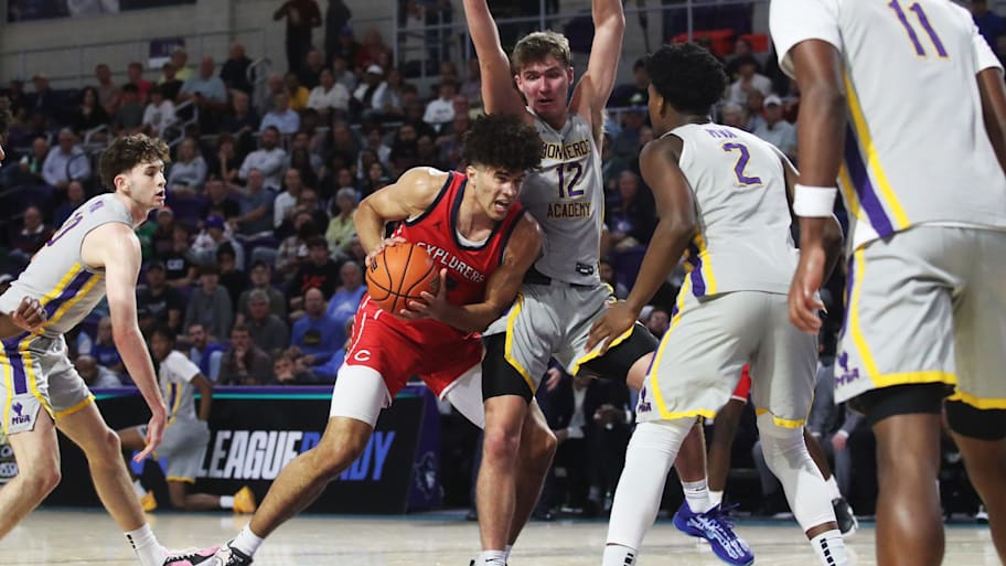 Cameron Boozer of the Miami Columbus High School basketball team drives to the basket against Montverde.