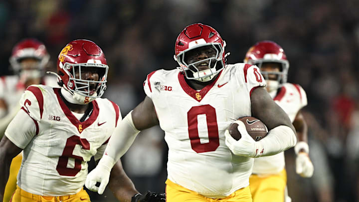 Sep 13, 2025; West Lafayette, Indiana, USA;  USC Trojans defensive tackle Jamaal Jarrett (0) runs the ball in for a touchdown after intercepting it during the second half against the Purdue Boilermakers at Ross-Ade Stadium. Mandatory Credit: Marc Lebryk-Imagn Images