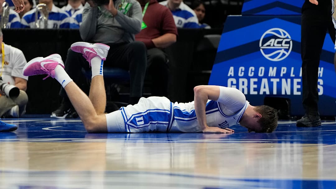 Mar 13, 2025; Charlotte, NC, USA; Duke Blue Devils forward Cooper Flagg (2) is injured in the first half at Spectrum Center. Mandatory Credit: Bob Donnan-Imagn Images