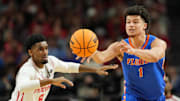 Apr 7, 2025; San Antonio, TX, USA; Florida Gators guard Walter Clayton Jr. (1) passes the ball against Houston Cougars guard Mylik Wilson (8) during the first half of the national championship game of the Final Four of the 2025 NCAA Tournament at the Alamodome.