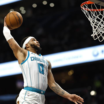 Mar 8, 2024; Washington, District of Columbia, USA; Charlotte Hornets forward Miles Bridges (0) dunks the ball against the Washington Wizards in the second half at Capital One Arena. Mandatory Credit: Geoff Burke-Imagn Images