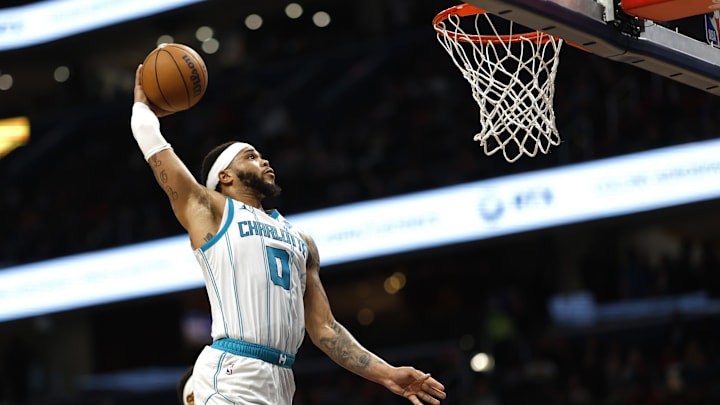 Mar 8, 2024; Washington, District of Columbia, USA; Charlotte Hornets forward Miles Bridges (0) dunks the ball against the Washington Wizards in the second half at Capital One Arena. Mandatory Credit: Geoff Burke-Imagn Images