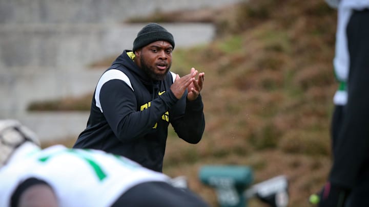 Oregon offensive line coach A'lique Terry leads a workout during spring practice with the Ducks in Eugene, Ore. Thursday, April, 13, 2023.

Sports Oregon Spring Practice