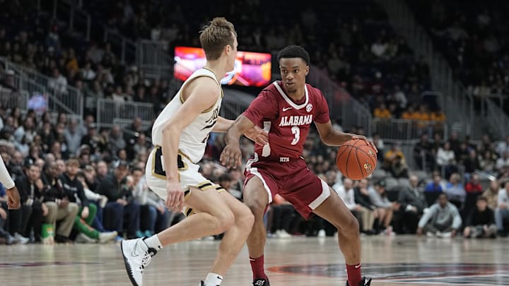 Dec 9, 2023; Toronto, Ontario, CAN; Alabama Crimson Tide guard Rylan Griffen (3) drives to the basket against Purdue Boilermakers guard Fletcher Loyer (2) during the first half at Coca-Cola Coliseum.