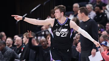 Mar 27, 2025; Salt Lake City, Utah, USA; Utah Jazz forward Kyle Filipowski (22) reacts after making a three-point shot against the Houston Rockets during the second half at Delta Center. Mandatory Credit: Rob Gray-Imagn Images