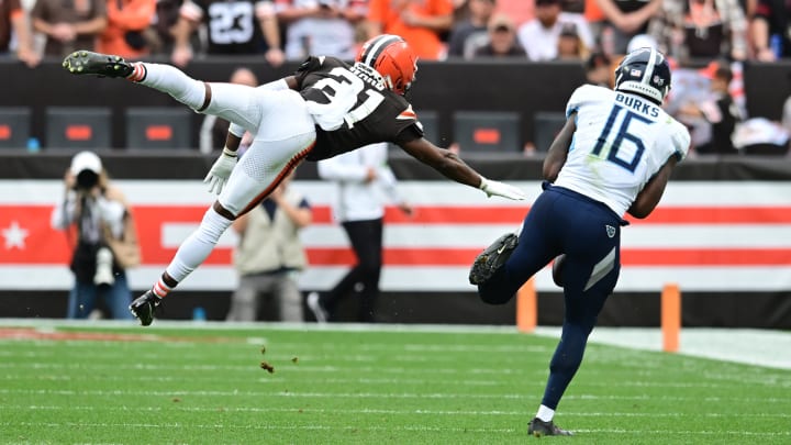 Sep 24, 2023; Cleveland, Ohio, USA; Cleveland Browns cornerback Denzel Ward (21) leaps to defend a pass to Tennessee Titans wide receiver Treylon Burks (16) during the second half at Cleveland Browns Stadium. Mandatory Credit: Ken Blaze-USA TODAY Sports