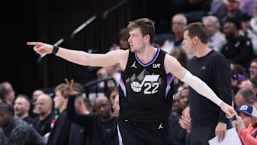 Mar 27, 2025; Salt Lake City, Utah, USA; Utah Jazz forward Kyle Filipowski (22) reacts after making a three-point shot against the Houston Rockets during the second half at Delta Center. Mandatory Credit: Rob Gray-Imagn Images
