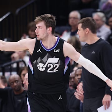 Mar 27, 2025; Salt Lake City, Utah, USA; Utah Jazz forward Kyle Filipowski (22) reacts after making a three-point shot against the Houston Rockets during the second half at Delta Center. Mandatory Credit: Rob Gray-Imagn Images