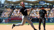 Jul 23, 2025; Los Angeles, California, USA;  Minnesota Twins pinch hitter Harrison Bader (12) reacts after hitting an RBI single during the eighth inning against the Los Angeles Dodgers at Dodger Stadium. Mandatory Credit: Kiyoshi Mio-Imagn Images