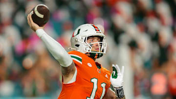 Oct 17, 2025; Miami Gardens, Florida, USA; Miami Hurricanes quarterback Carson Beck (11) throws the football against the Louisville Cardinals during the second quarter at Hard Rock Stadium. Mandatory Credit: Sam Navarro-Imagn Images