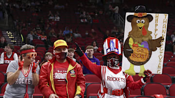 Nov 24, 2021; Houston, TX; A Houston Rockets fan holds a sign for the Thanksgiving holiday before a game against the Chicago Bulls