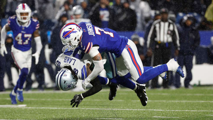 Buffalo Bills cornerback Taron Johnson (7) makes the tackle on Dallas Cowboys wide receiver CeeDee Lamb (88).