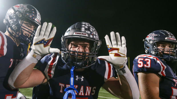 Wimberley's Owen O'Neal celebrates a 38-13 4A-D2 regional final win over Sinton in San Antonio on Dec. 1, 2023.