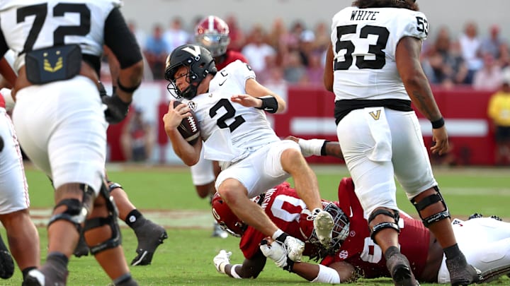 Oct 4, 2025; Tuscaloosa, Alabama, USA; Vanderbilt Commodores quarterback Diego Pavia (2) is tackled during the second half against the Alabama Crimson Tide at Saban Field at Bryant-Denny Stadium. Mandatory Credit: David Leong-Imagn Images Oct 4, 2025; Tuscaloosa, Alabama, USA; Vanderbilt Commodores quarterback Diego Pavia (2) is tackled during the second half against the Alabama Crimson Tide at Saban Field at Bryant-Denny Stadium. Mandatory Credit: David Leong-Imagn Images