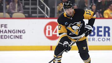 Mar 21, 2025; Pittsburgh, Pennsylvania, USA;  Pittsburgh Penguins right wing Bryan Rust (17) skates up ice with the puck against the Columbus Blue Jackets during the first period at PPG Paints Arena. Mandatory Credit: Charles LeClaire-Imagn Images