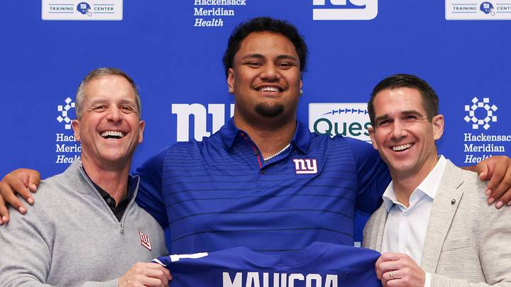 Apr 24, 2026; East Rutherford, NJ, USA; New York Giants draft pick Francis Mauigoa, Head Coach John Harbaugh (left) and General Manager Joe Schoen