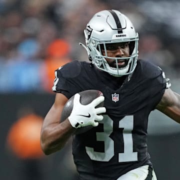 Nov 2, 2025; Paradise, Nevada, USA; Las Vegas Raiders running back Raheem Mostert (31) runs the ball during the second half against the Jacksonville Jaguars at Allegiant Stadium. Mandatory Credit: Kirby Lee-Imagn Images