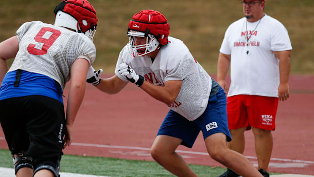 Nixa High School freshman Jackson Cantwell (right) runs drills during football practice on Tuesday, July 12, 2022. Cantwell i
