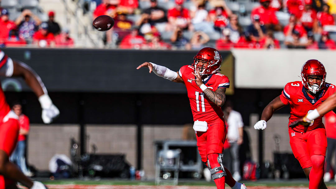 Nov 30, 2024; Tucson, Arizona, USA; Arizona Wildcats quarterback Noah Fifita (11) throws the ball during the second quarter against the Arizona State Sun Devils at Arizona Stadium. Mandatory Credit: Aryanna Frank-Imagn Images
