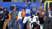 Oct 9, 2025; East Rutherford, New Jersey, USA; New York Giants wide receiver Lil'Jordan Humphrey (89) signals first down after catching a pass against Philadelphia Eagles cornerback Kelee Ringo (7) during the first quarter at MetLife Stadium.  