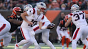 Nov 23, 2025; Cincinnati, Ohio, USA; New England Patriots quarterback Drake Maye (10) hands off during the first half against the Cincinnati Bengals at Paycor Stadium. Mandatory Credit: Joseph Maiorana-Imagn Images