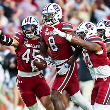 Oct 25, 2025; Columbia, South Carolina, USA; South Carolina Gamecocks wide receiver Nyck Harbor (8) and teammates celebrate a Harbor fumble recovery against the Alabama Crimson Tide on a punt in the fourth quarter at Williams-Brice Stadium. Mandatory Credit: Jeff Blake-Imagn Images