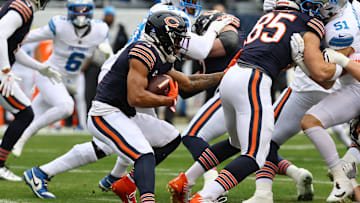 Dec 22, 2024; Chicago, Illinois, USA; Chicago Bears wide receiver DJ Moore (2) rushes the ball against the Detroit Lions during the first quarter at Soldier Field. Mandatory Credit: Mike Dinovo-Imagn Images