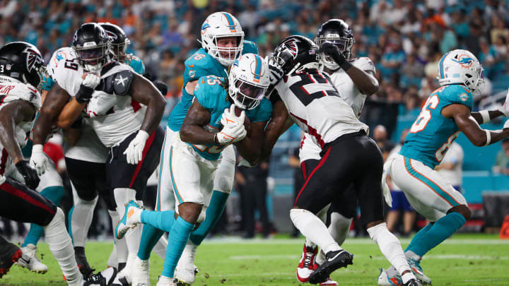 Aug 9, 2024; Miami Gardens, Florida, USA; Miami Dolphins running back Jaylen Wright (25) scores a touchdown against the Atlanta Falcons in the second quarter during preseason at Hard Rock Stadium.