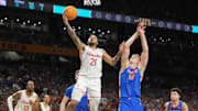 Apr 7, 2025; San Antonio, TX, USA; Houston Cougars guard Emanuel Sharp (21) shoots against Florida Gators forward Thomas Haugh (10) in the second half in the national championship game of the Final Four of the 2025 NCAA Tournament at the Alamodome. Mandatory Credit: Robert Deutsch-Imagn Images