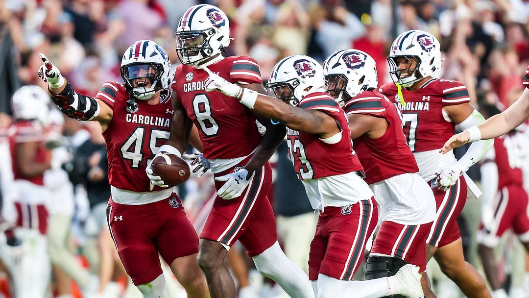 Oct 25, 2025; Columbia, South Carolina, USA; South Carolina Gamecocks wide receiver Nyck Harbor (8) and teammates celebrate a Harbor fumble recovery against the Alabama Crimson Tide on a punt in the fourth quarter at Williams-Brice Stadium. Mandatory Credit: Jeff Blake-Imagn Images