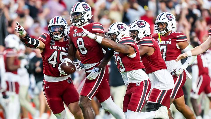Oct 25, 2025; Columbia, South Carolina, USA; South Carolina Gamecocks wide receiver Nyck Harbor (8) and teammates celebrate a Harbor fumble recovery against the Alabama Crimson Tide on a punt in the fourth quarter at Williams-Brice Stadium. Mandatory Credit: Jeff Blake-Imagn Images