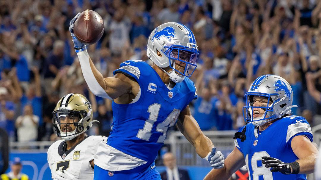 Sep 13, 2026; Detroit, Michigan, USA;  etroit Lions wide receiver Amon-Ra St. Brown (14) and wide receiver Isaac TeSlaa (18) celebrate a touchdown against the New Orleans Saints in overtime at Ford Field.  Mandatory Credit: David Reginek-Imagn Images